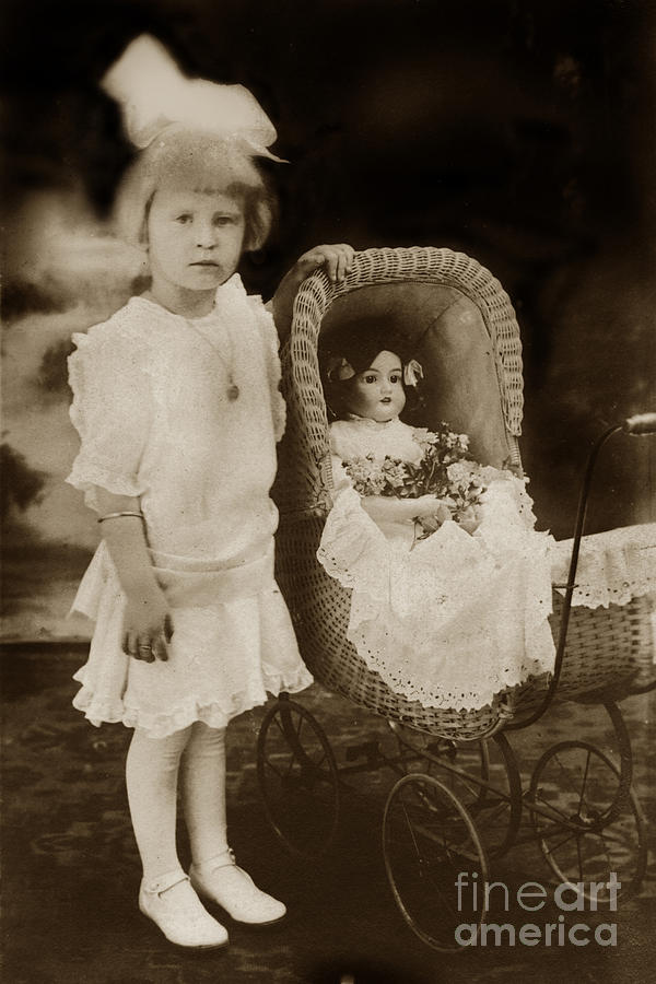 Doll Photograph - little Victorian girl with a wicker doll  carriage 1900 by Monterey County Historical Society