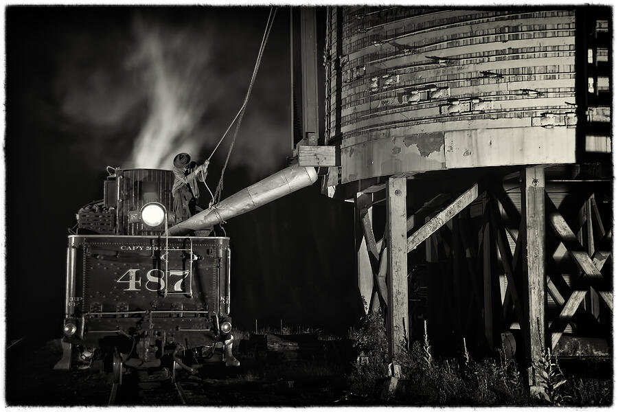 Black And White Photograph - Loading Water at Chama Train Station by Priscilla Burgers