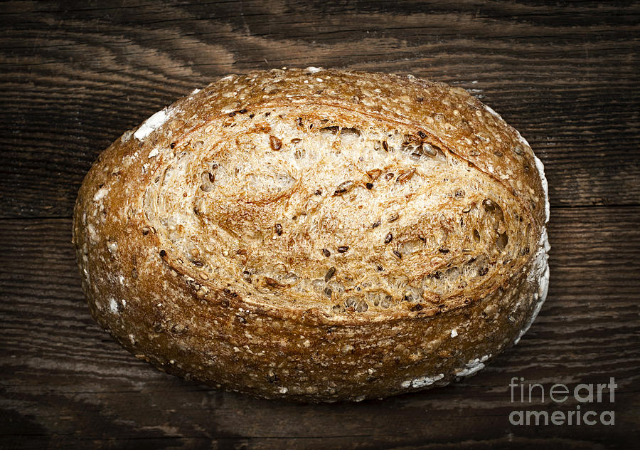 Loaf of multigrain artisan bread Photograph by Elena Elisseeva