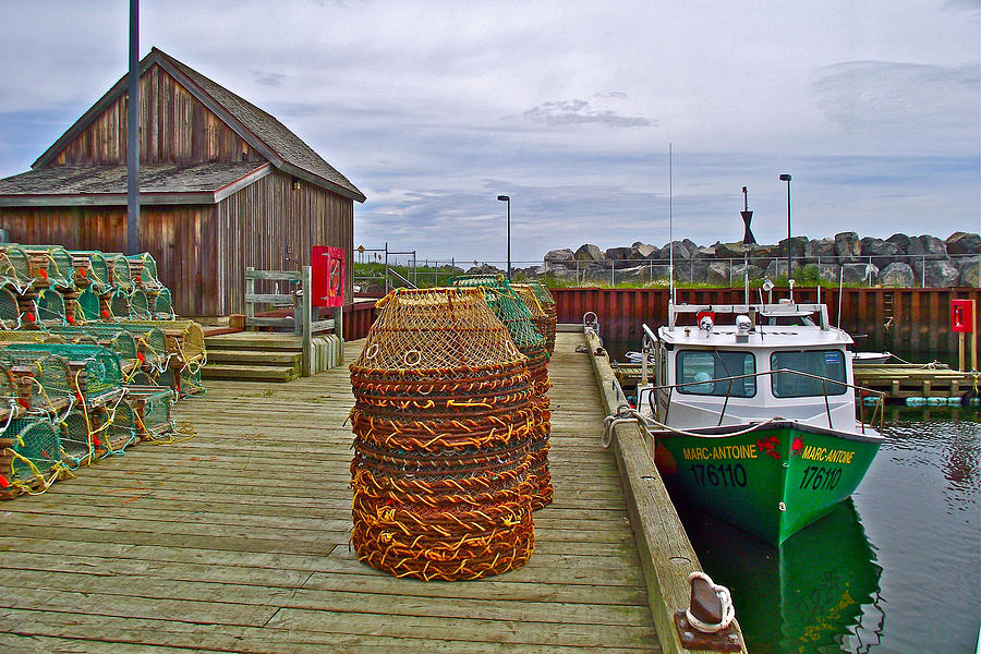 Lobster Fishing Baskets and Boats by a Dock in ForillonNational Park, Quebec, Canada Photograph by Ruth Hager
