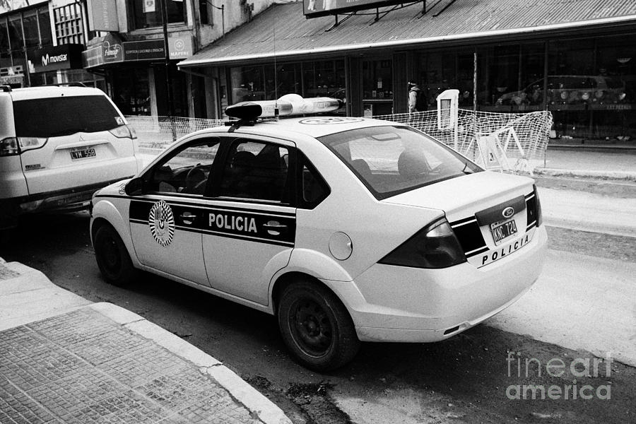 Car Photograph - local provincial tierra del fuego police patrol car policia Ushuaia Argentina by Joe Fox