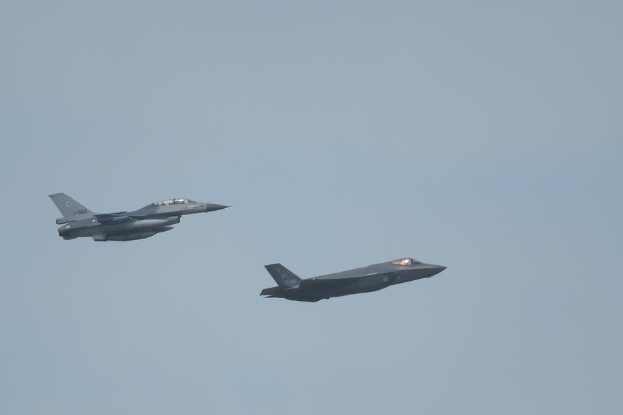 Lockheed Martin F-35 Joint Strike Fighter and F-16 Fighting Falc Photograph by Sjo