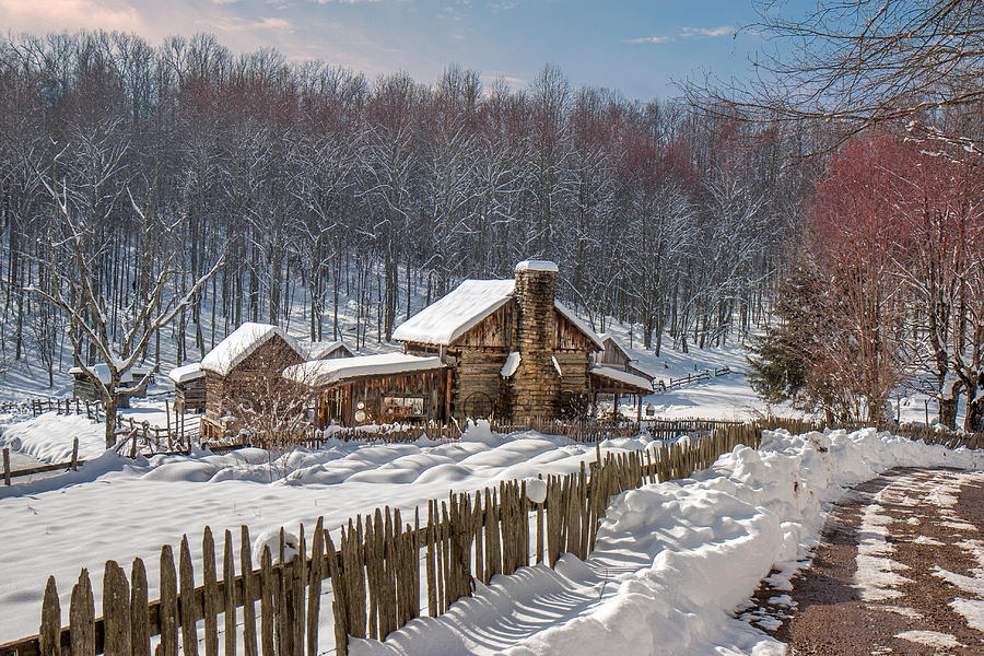 Log cabin in snow Photograph by Mary Almond