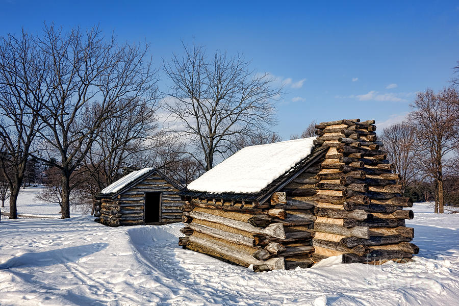 Log Cabins in Snow Photograph by Olivier Le Queinec