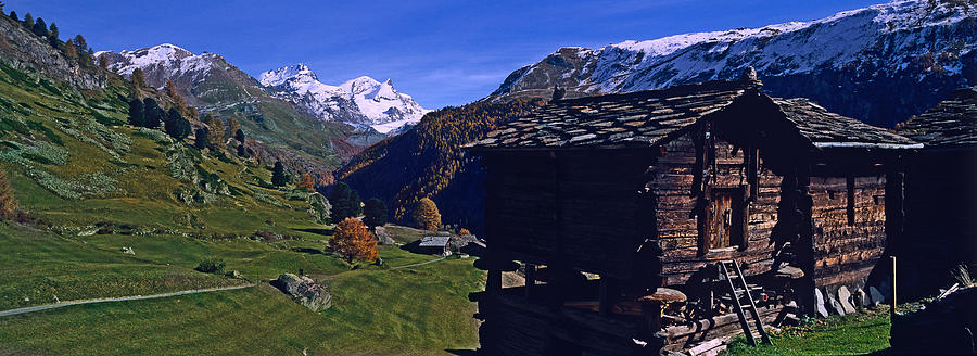 Color Image Photograph - Log Cabins On A Landscape, Matterhorn by Panoramic Images Color Image Photograph - Log Cabins On A Landscape, Matterhorn by Panoramic Images