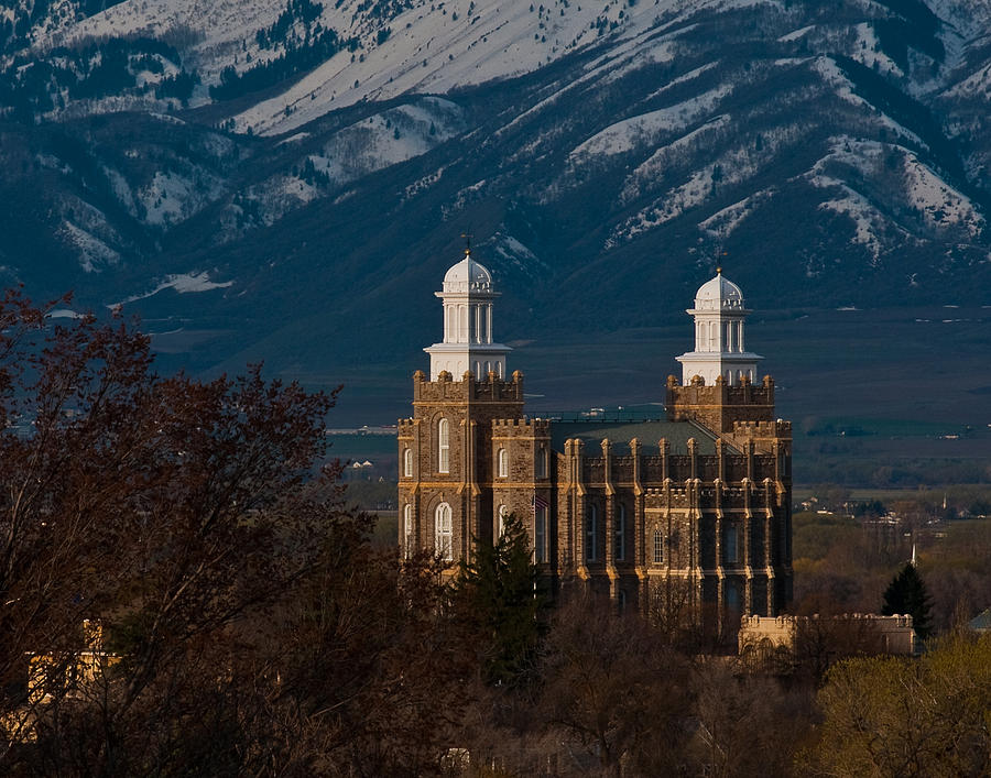 Logan Temple with snow on mountains Photograph by Neal Jorgensen - Fine