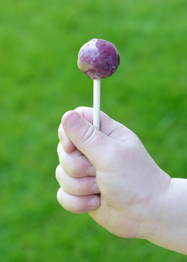 Lollipop in Hand Photograph by AnthonyRosenberg