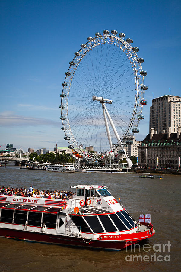London Eye and a river cruiser on the river thames Photograph by Peter Noyce