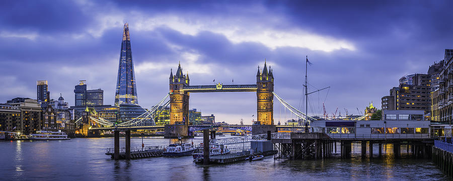 London Tower Bridge and The Shard illuminated over Thames panorama Photograph by fotoVoyager