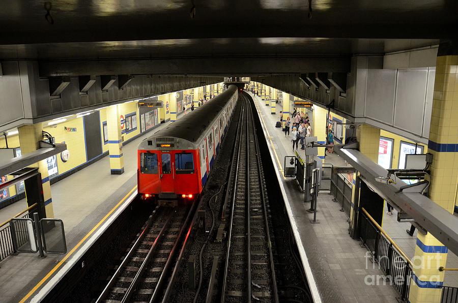 London Underground tube subway train leaves station platform Photograph by Imran Ahmed