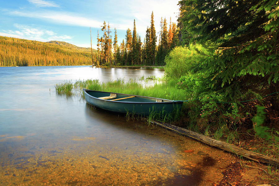 Lone Canoe On Shores Of Upper Payette Photograph by Anna Gorin Lone Canoe On Shores Of Upper Payette Photograph by Anna Gorin