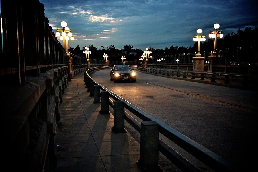 Lone Car On Night Drive On Curved Bridge Photograph by Karol Franks
