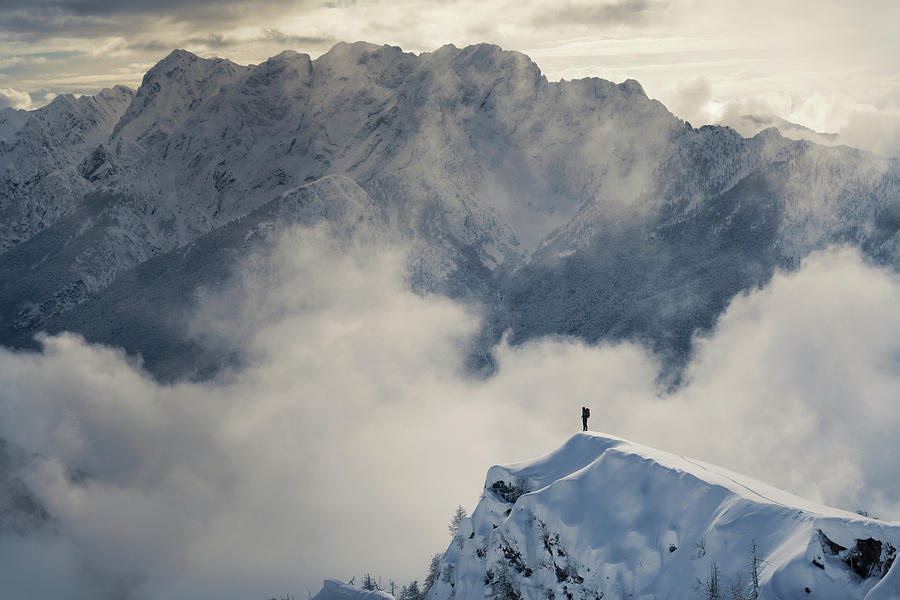 Lone Climber Standing On A Snowy Peak Photograph by Buena Vista Images