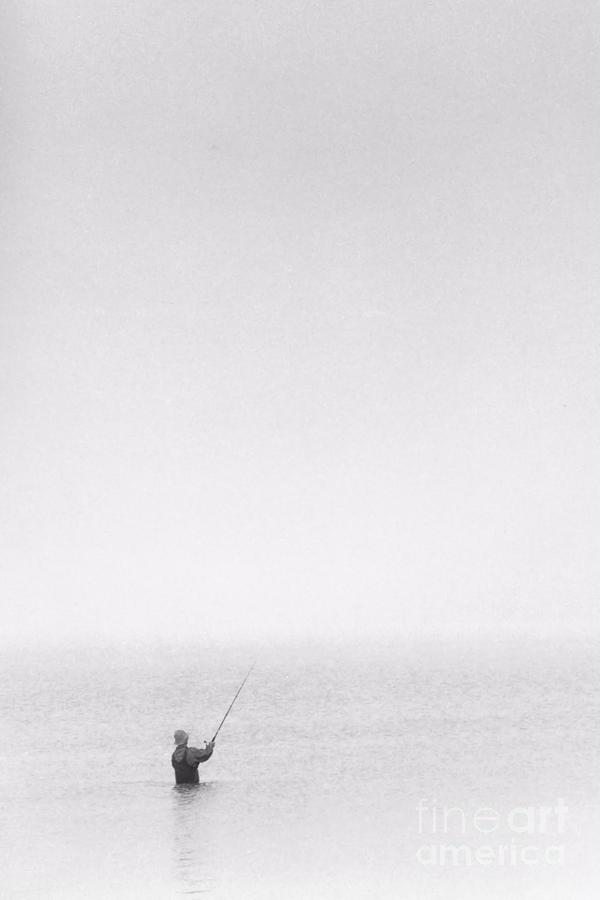 Lone Fisherman in Fog Photograph by John Harmon