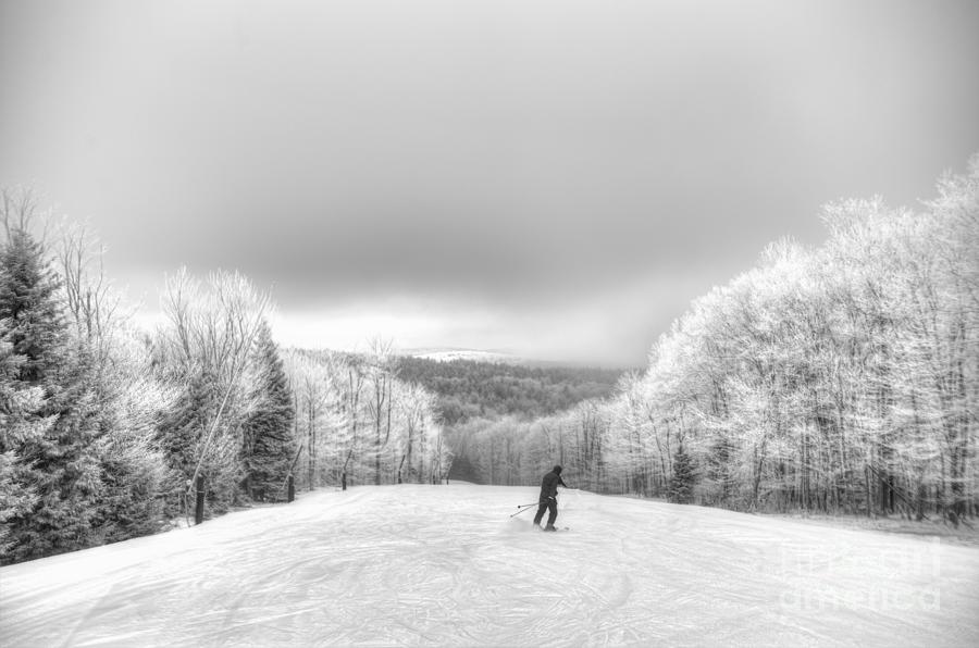 Lone skier on mountain Photograph by Dan Friend