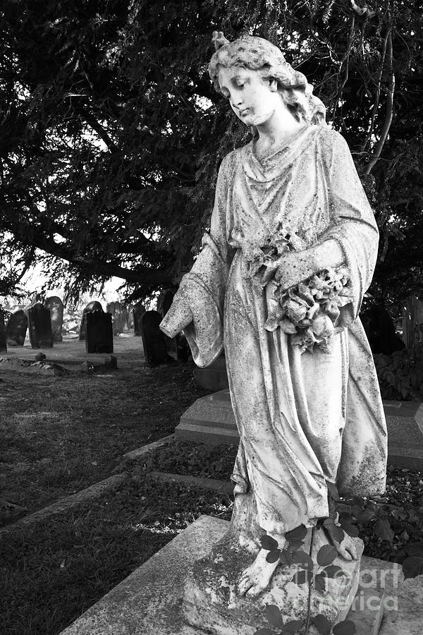 Black And White Photograph - Lonely Girl in Cemetery by James Brunker