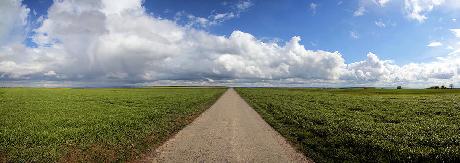 Lonely Tarred Road And Clouded Sky Photograph by Hans-peter Merten
