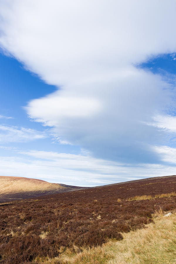 Long cloud forming in the Wicklow Mountains Photograph by Semmick Photo