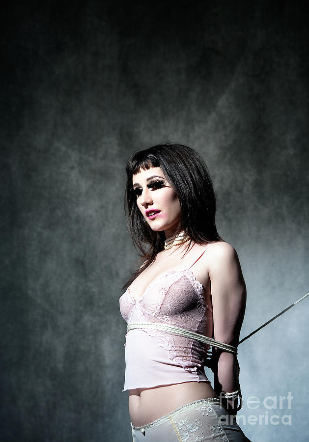 Rope Photograph - Long Dark Haired Woman In Pink Lingerie Tied Up With A Rope by Joe Fox