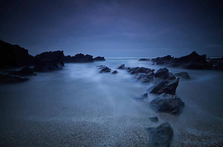 Long Exposure Of Rocks On The Beach At Photograph by James Ingham / Design Pics