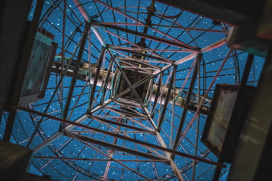Looking at starry sky from below a radio telescope antenna Photograph by Haitong Yu