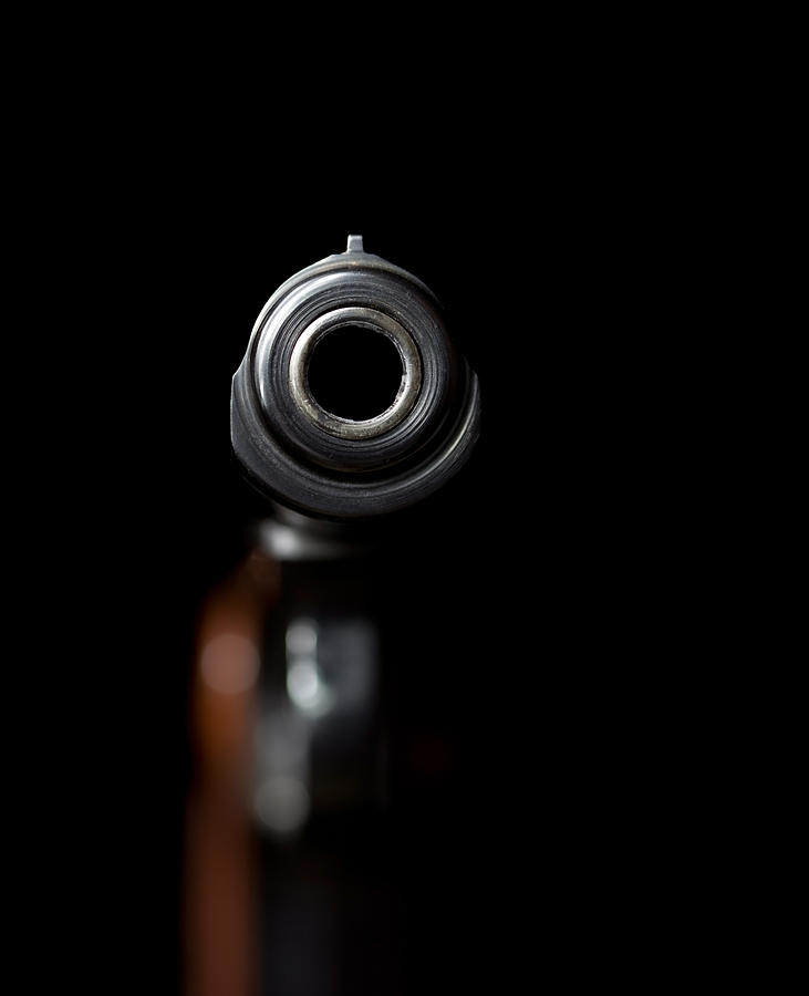 Looking Down a Handgun Barrel on Black Photograph by BanksPhotos