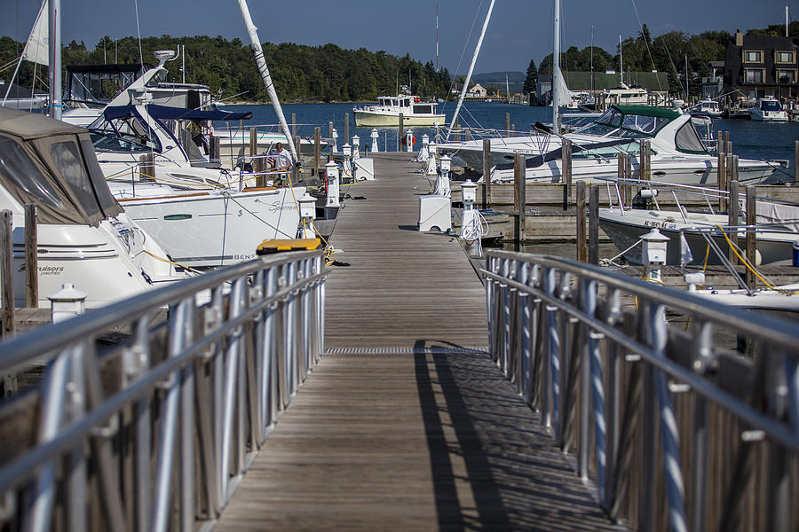 Looking down the dock Photograph by John McGraw