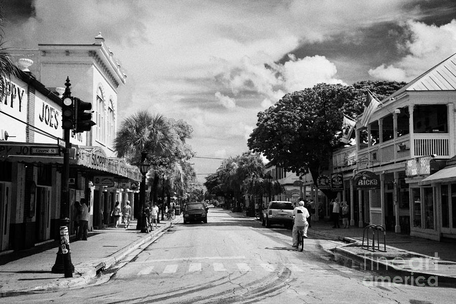 Key Photograph - Looking Up Duval Street In Old Town Key West Florida Usa by Joe Fox