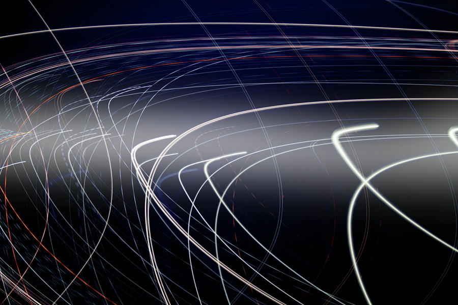 Lots Of Curving Light Trails Photograph by Ikon Ikon Images