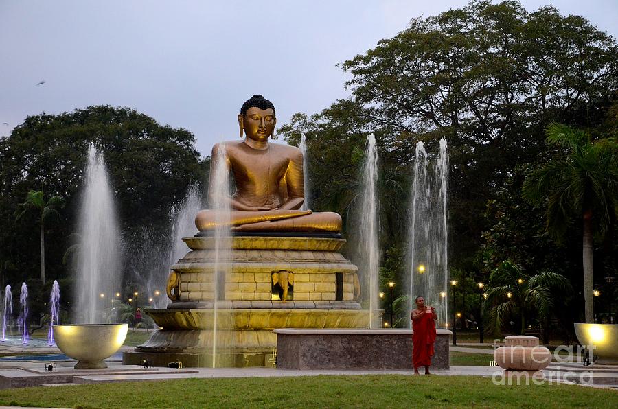 Buddha Photograph - Lotus Buddha statue with fountains in park with Buddhist monk Colombo Sri Lanka by Imran Ahmed