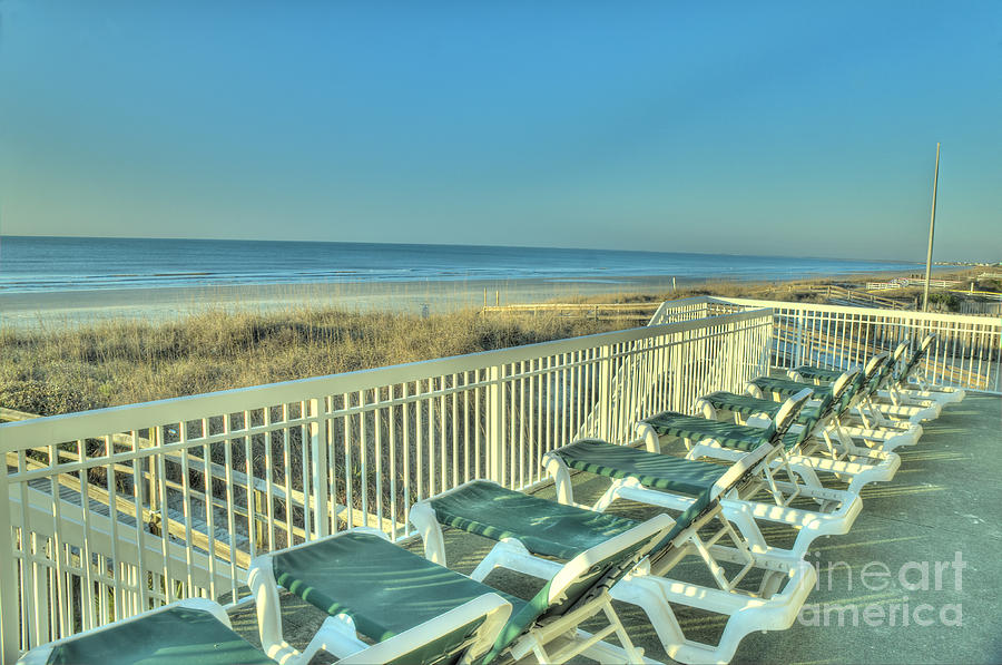 Lounge Chairs Overlooking Beach Photograph by Ules Barnwell