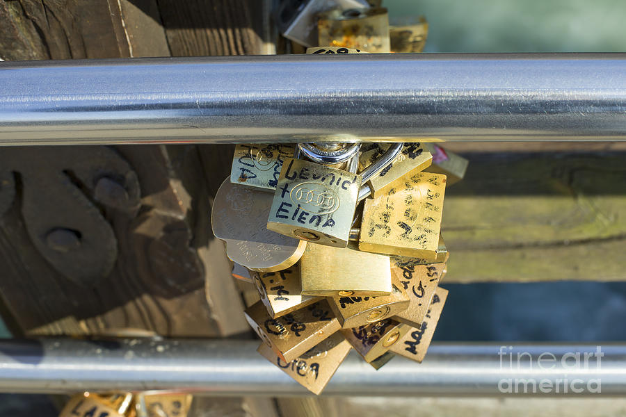 Love locks on a bridge in Venice Photograph by Patricia Hofmeester
