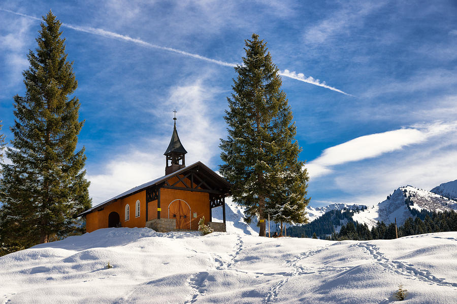 Lovely little mountain chapel in winter in the Alps Photograph by Matthias Hauser