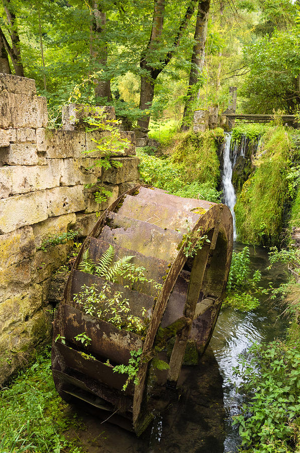 Lovely old mill wheel in small river Photograph by Matthias Hauser