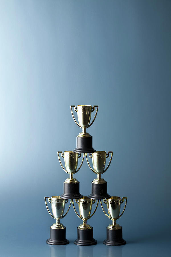 Still Life Photograph - Loving Cup Trophies Stacked In A Pyramid by Larry Washburn