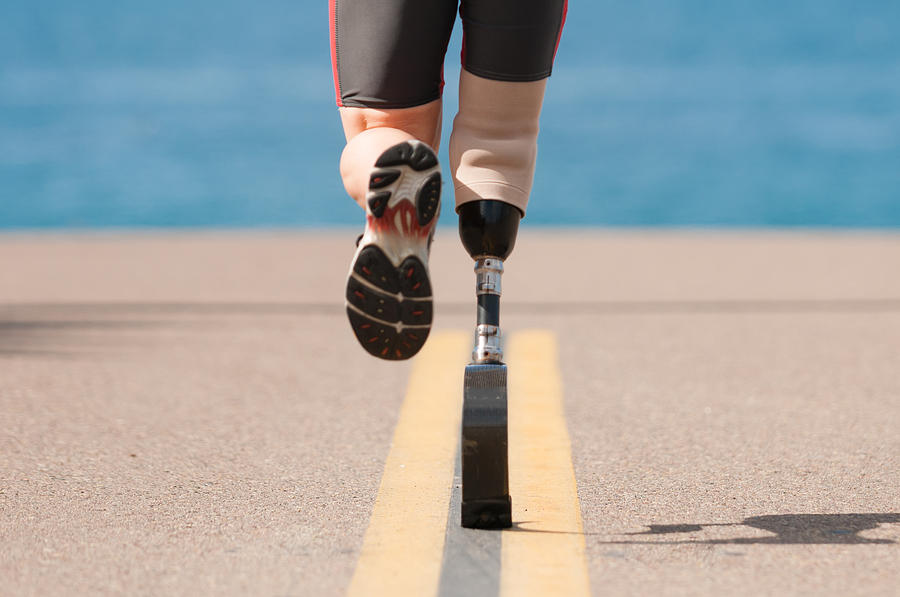 Low Angle Of Prosthetic Leg Running Photograph by MichaelSvoboda