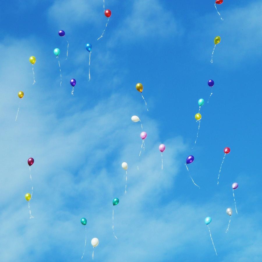 Low Angle View Of Balloons Flying Against Sky Photograph by Alexey Ivanov / EyeEm
