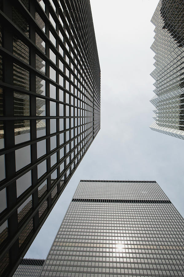 Low Angle View Of Skyscrapers Towering Photograph by Michael Interisano / Design Pics