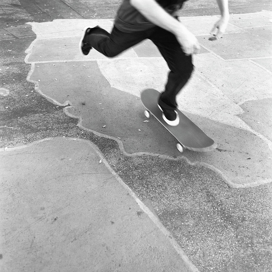 Low Section Of A Skateboarder Photograph by Brian Caissie