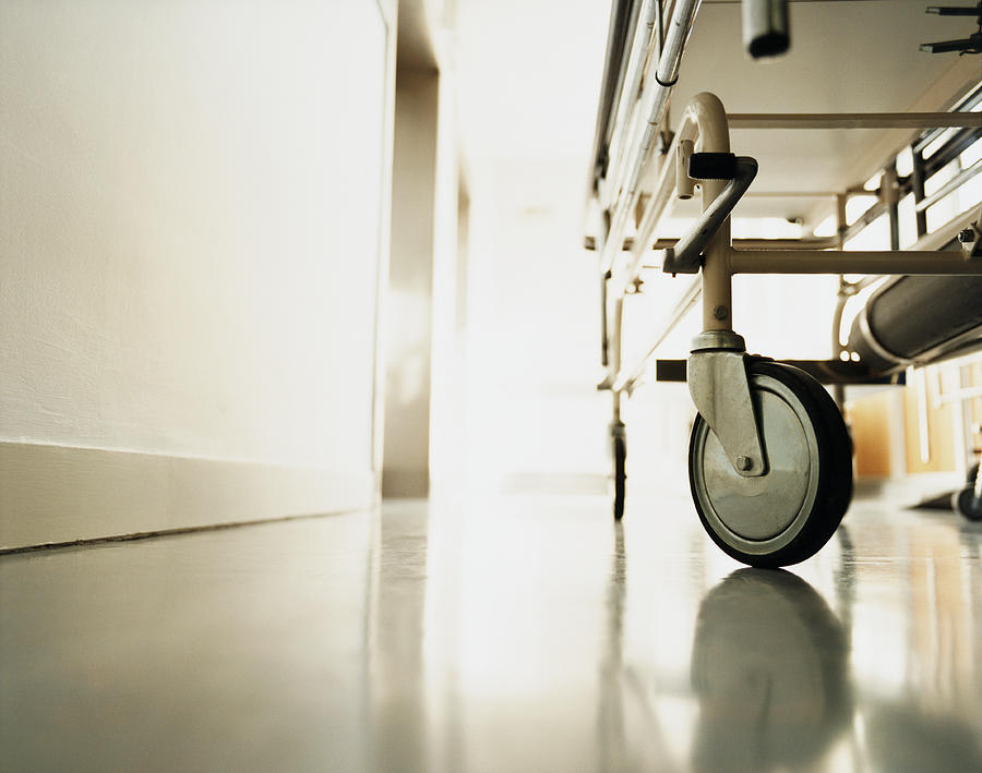 Low Section of a Trolley in a Hospital Corridor Photograph by Janie Airey