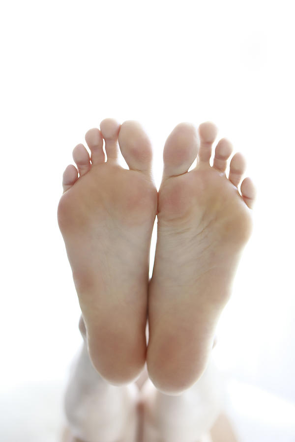 Low Section Of Woman With Feet Up Photograph by Runstudio