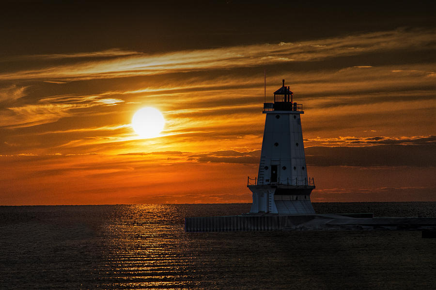 Ludington Pier Lighthead at Sunset Photograph by Randall Nyhof