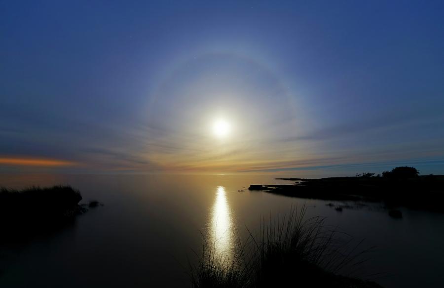 Lunar Halo Over Water Photograph by Luis Argerich