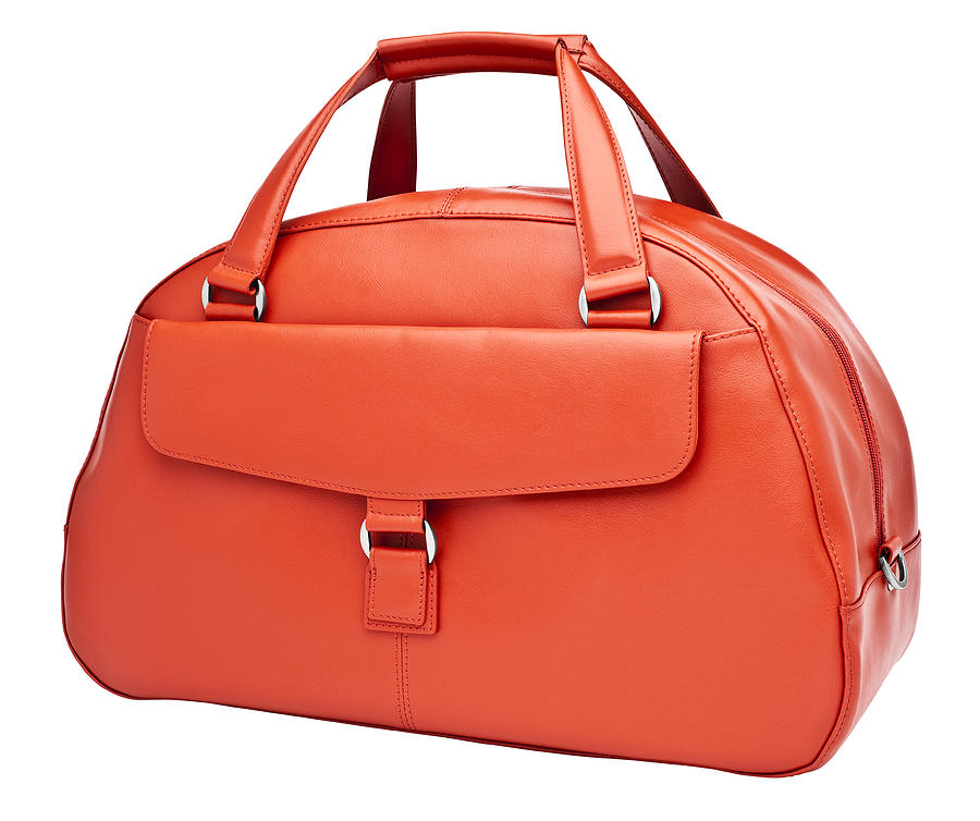 Luxury womans orange leather handbag Photograph by Creative Crop