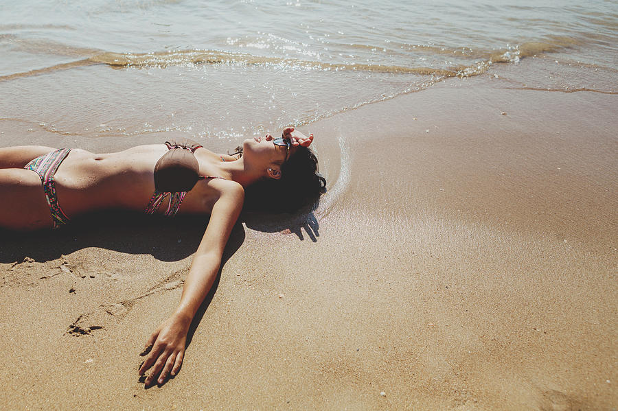 lying on a on a beach,Dona Ana,lagos Photograph by Carol Yepes