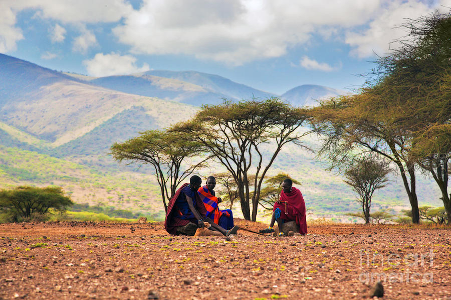 Maasai men sitting. Savannah landscape in Tanzania Photograph by Michal Bednarek