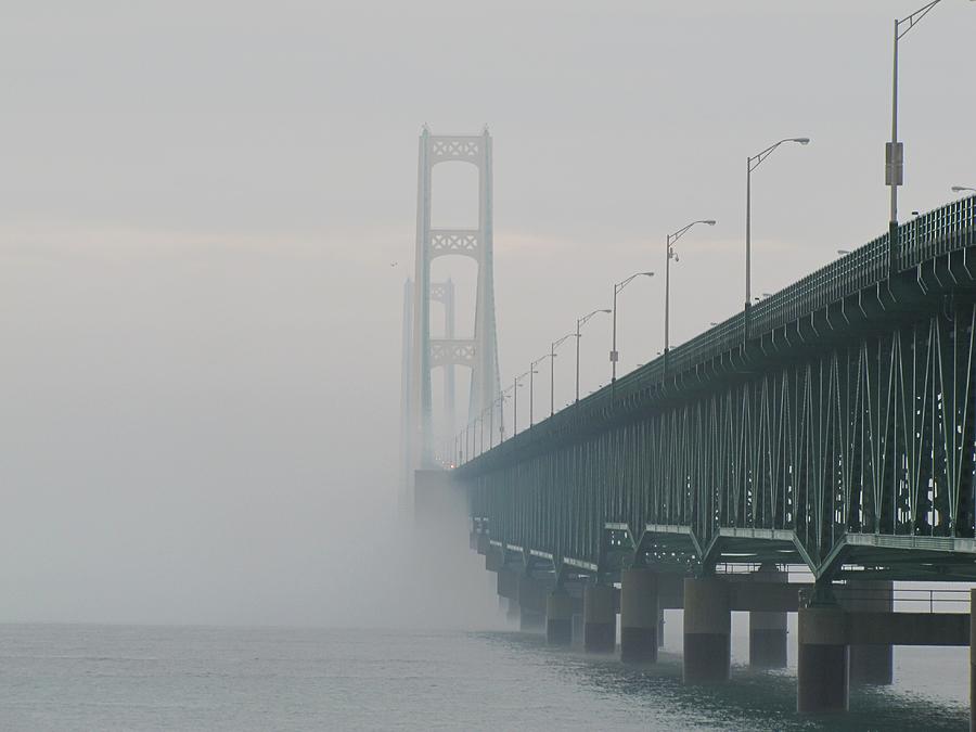 Mackinac Bridge shrouded in fog Photograph by Keith Stokes