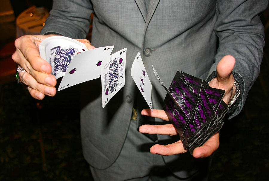 Magician illusionist performing card trick Photograph by Image by Marie LaFauci