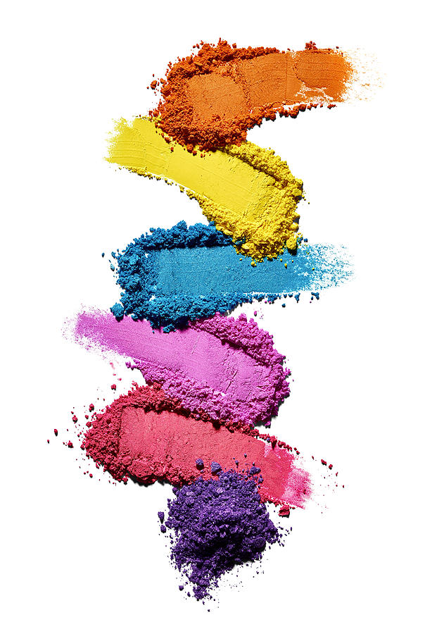 Make-up powder in different colours in front of white background Photograph by Westend61
