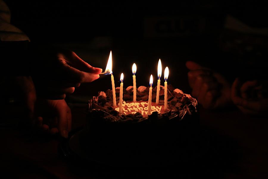 Making a traditional birthday wish Photograph by Douglas Sacha